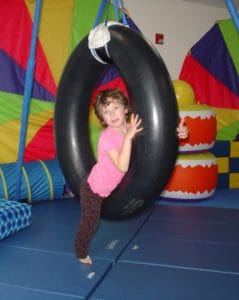 Girl on tire swing