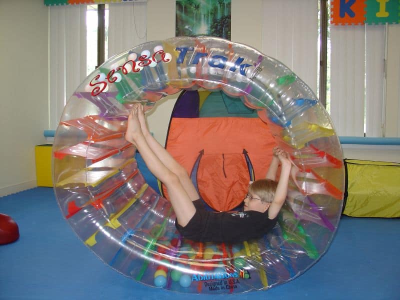 kid playing in tube